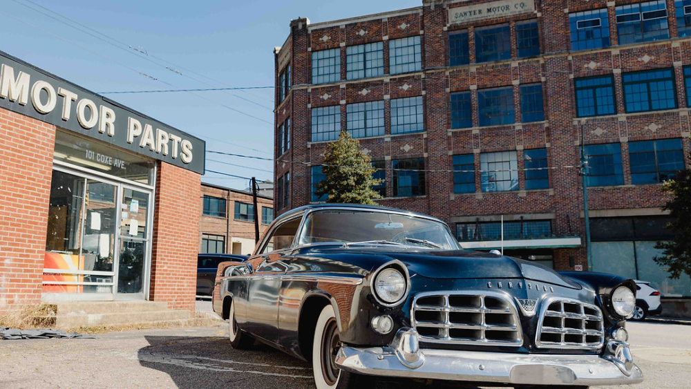 A vintage 1956 Chrysler 300 B parked in front of the Motor Parts store on Coxe Avenue.