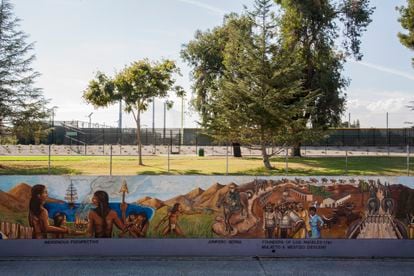 The historical events and figures depicted in the mural are accompanied by descriptive captions.