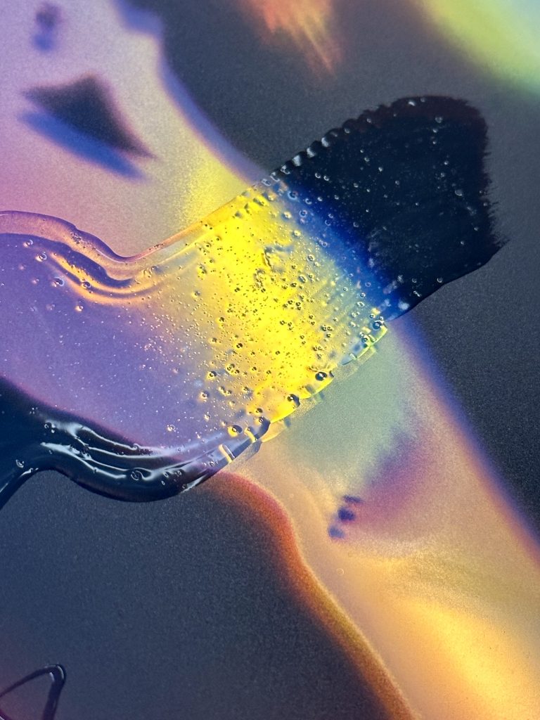 An example of one of Victoria Fu's paintings on printed images on glass.