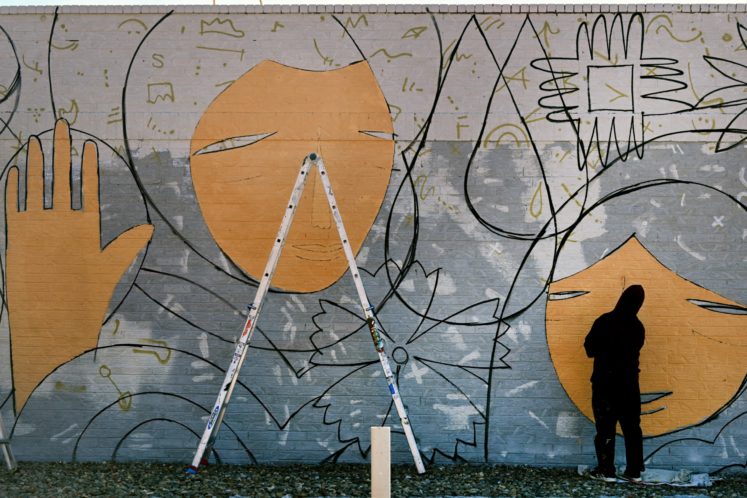 Muralist Pedro Barrios works on a mural project for Novo Legal Group at 4280 Morrison Road in Denver on March 9, 2023. (Photo by Helen H. Richardson/The Denver Post)