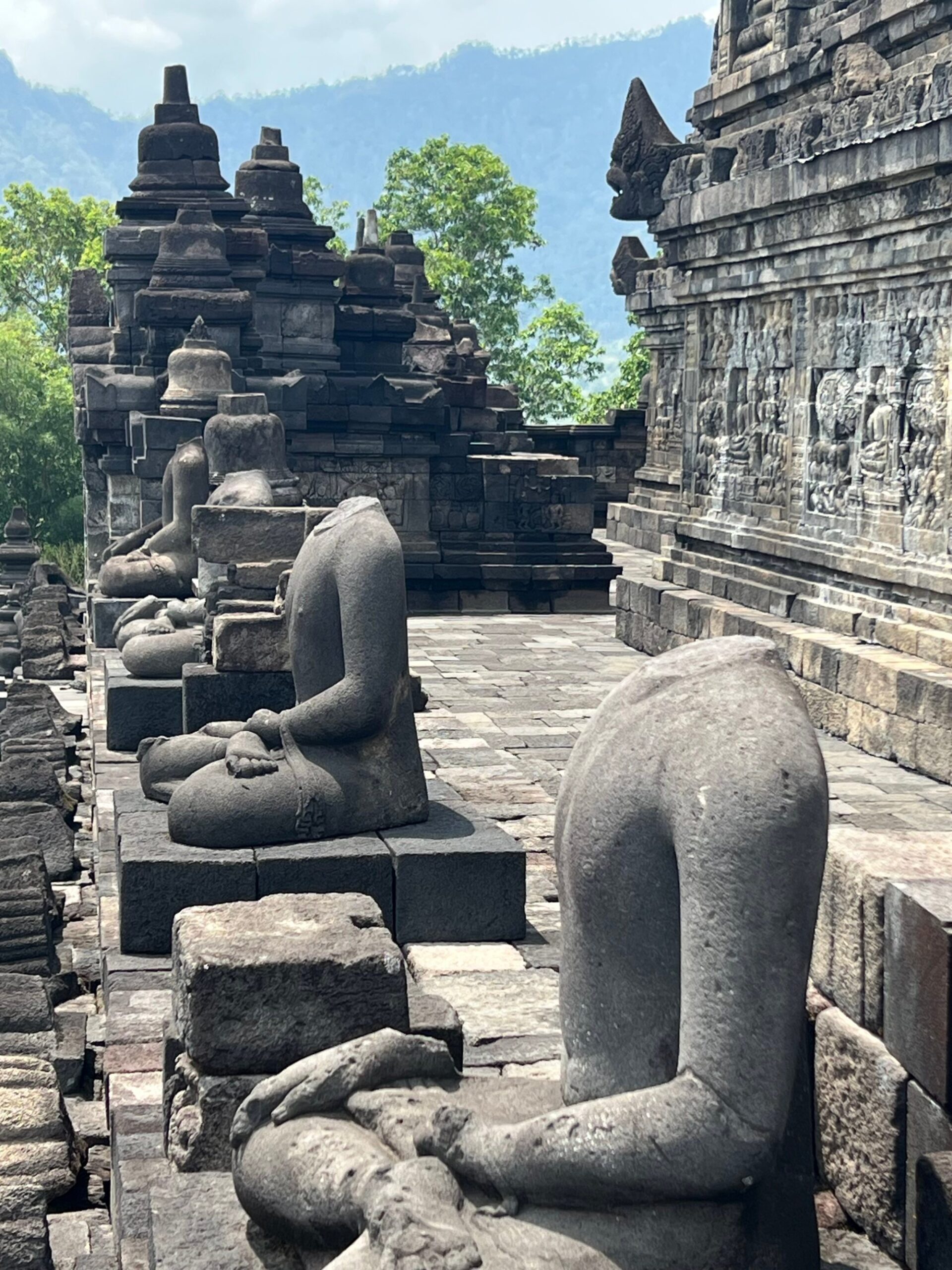 Headless Buddha statues at the temple. Photo: Penny Watson