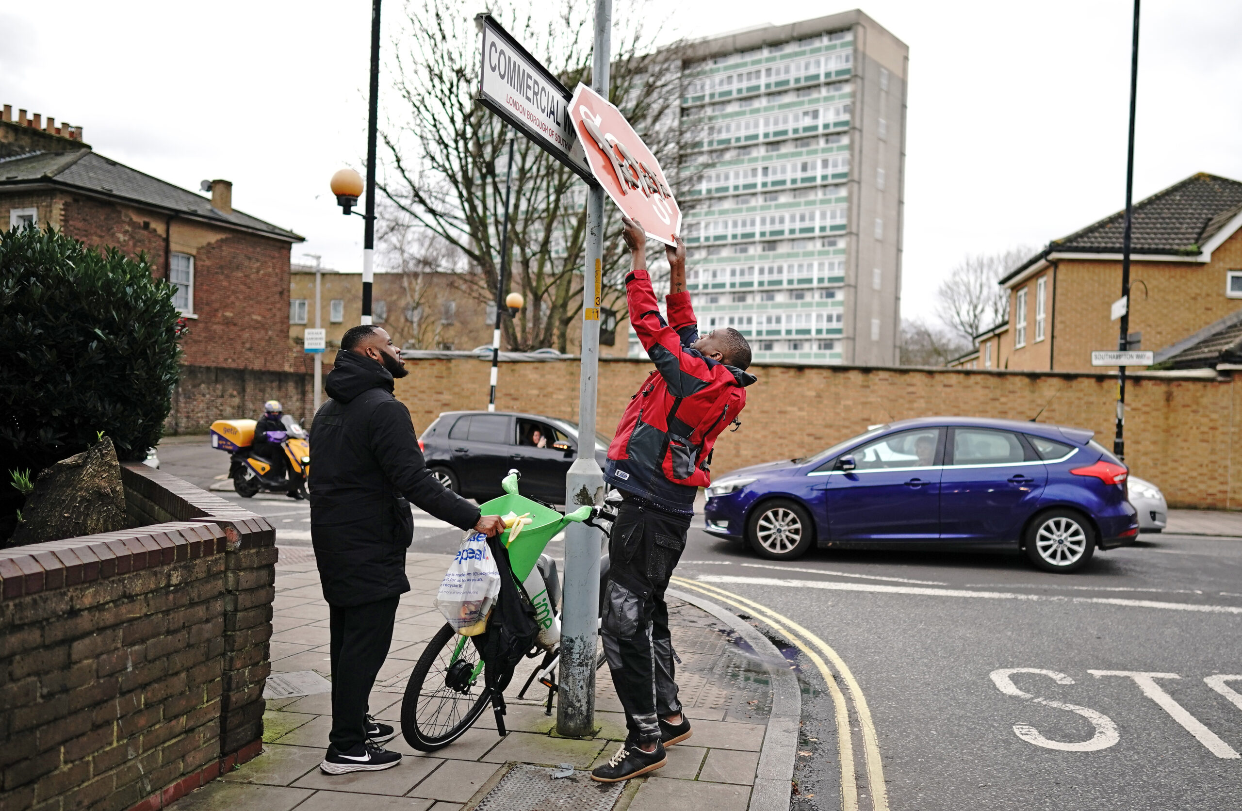 Two men removed the sign