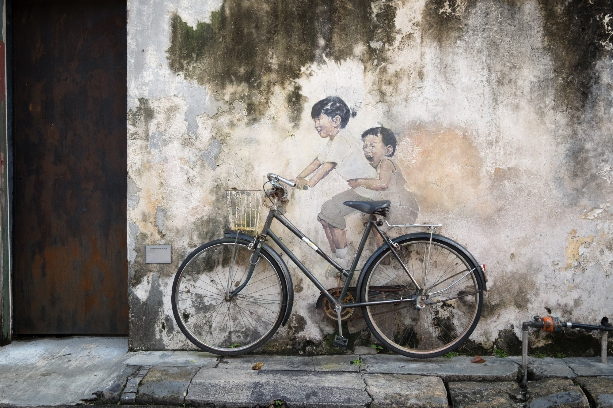 “Little Children on a Bicycle”, by Ernest Zacharevic, in George Town. Photo: Shutterstock