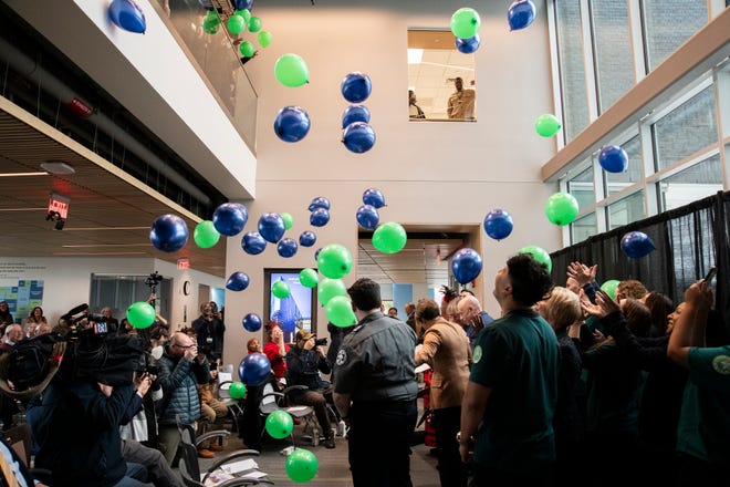 Balloons are dropped from the second floor at the close of the ribbon cutting ceremony for the Center for Health Sciences, Early Childhood and Human Services at MassBay Community College on Franklin Street in Framingham, Jan. 30, 2024.