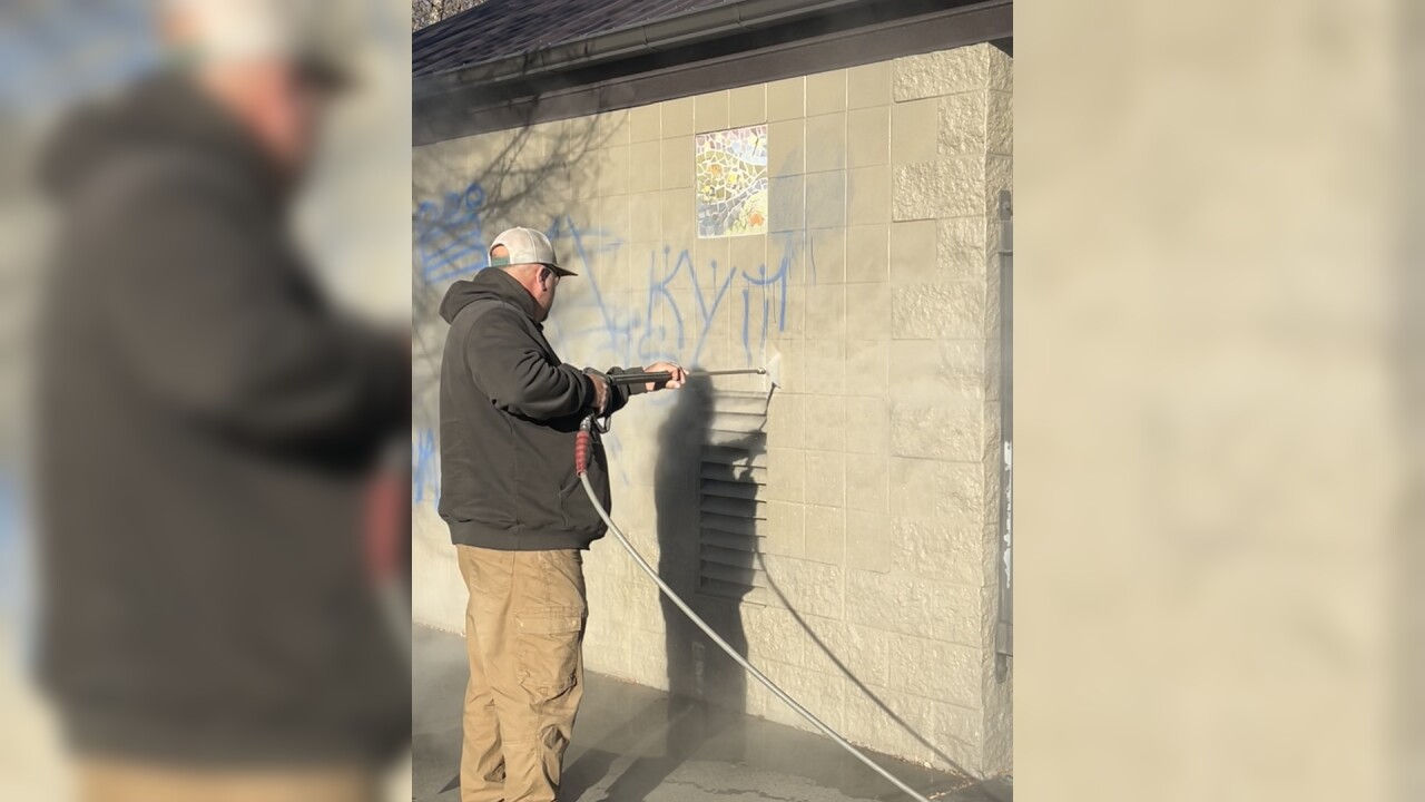 Pressure washing the graffiti