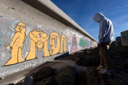 Imon Boy in front of another of his graffiti art pieces in Vélez-Málaga, Spain.