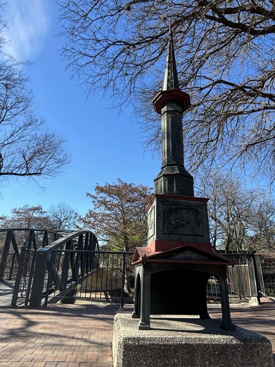 One of the four ornate corner posts from the original, that were placed on the walkbridge