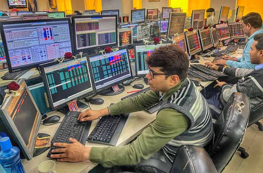 Brokers remained busy watching the Interim Budget session inside a stock broker house in Kolkata on Thursday