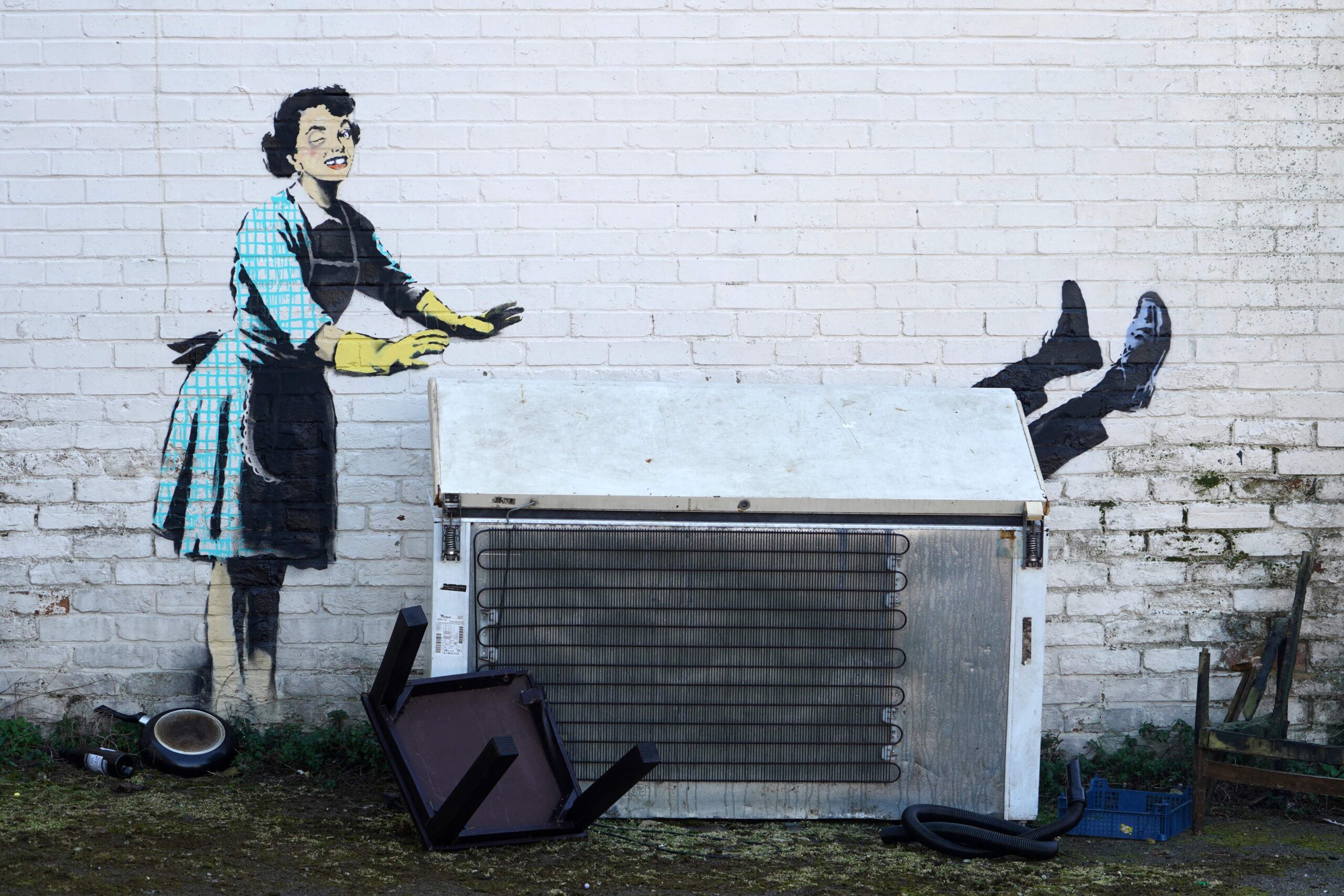 Among his recent additions is a mural in Margate in Kent, depicting a 1950s housewife wearing an apron and washing-up gloves while shoving a man into a freezer