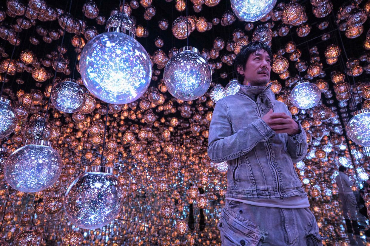 Toshiyuki Inoko, founder of teamLab, takes part in an interview session. The previous location of 'teamLab Borderless' held the Guinness World Record for the most-visited museum dedicated to a single art group, with nearly 2.2 million admissions in one year. Photo: AFP 