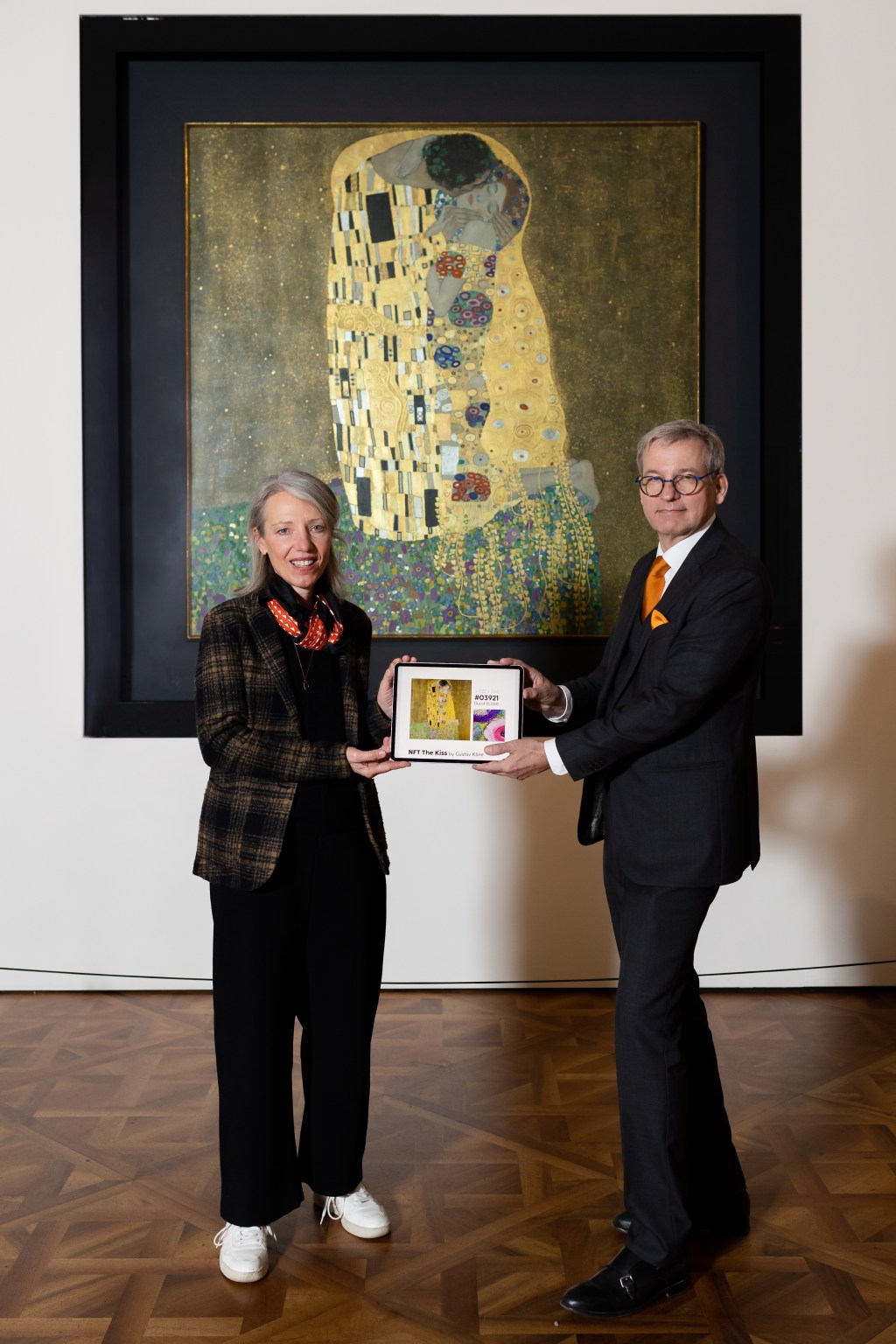 Two people posing in front of the physical