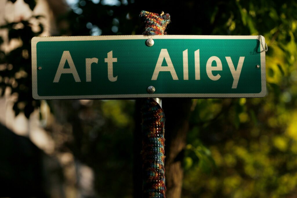 The Art Alley street sign is illuminated by a shaft of sunlight in the SOFA arts district of Santa Rosa, California, on Friday, May 3, 2019. (Alvin Jornada / The Press Democrat)
