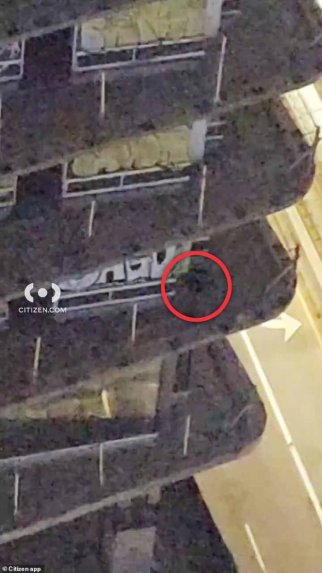 Footage has emerged of a person on the balcony of one of the buildings allegedly working on the artwork just before midnight on January 30