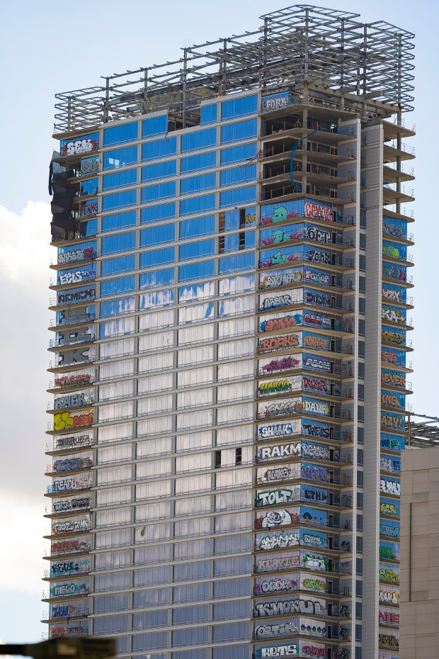 An unfinished high-rise development in the downtown entertainment district that...