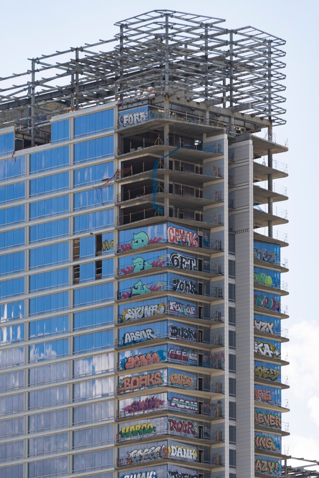 An unfinished high-rise development in the downtown entertainment district that...