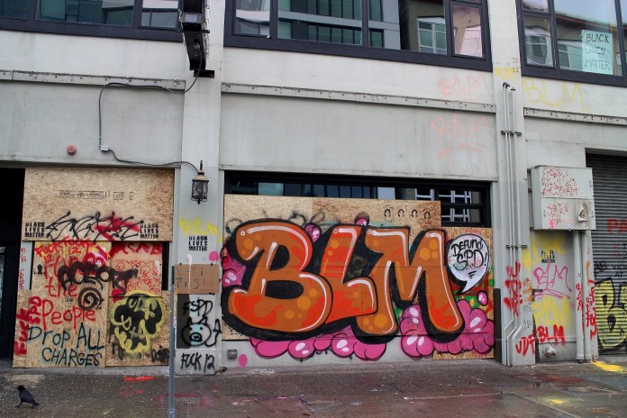 Seattle graffiti in Seattle Autonomous Zone, Brian Gomes Bascoy - https-::www.flickr.com:photos:peramides:49982657672: