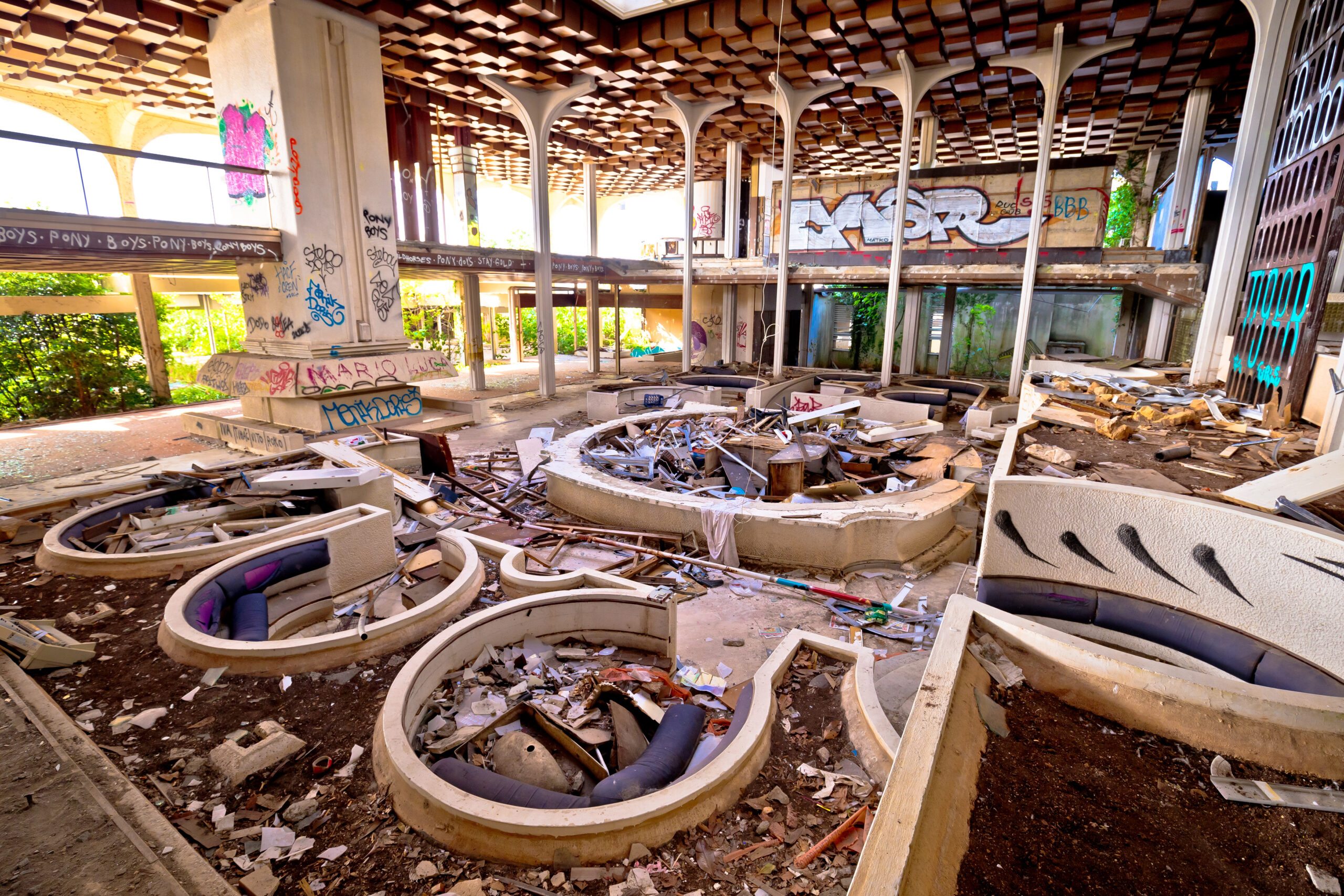 The hall is littered with debris and shattered glass