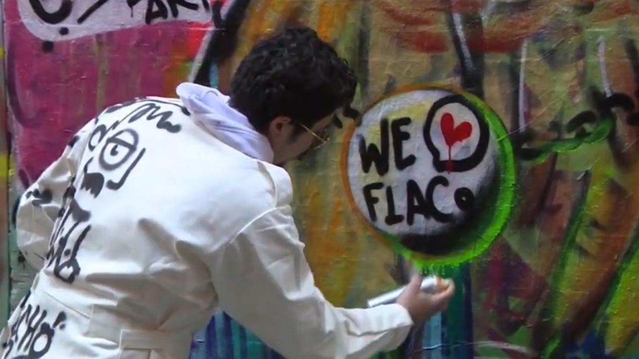 <div>Calicho Arevalo's fixes his Flaco mural.</div>