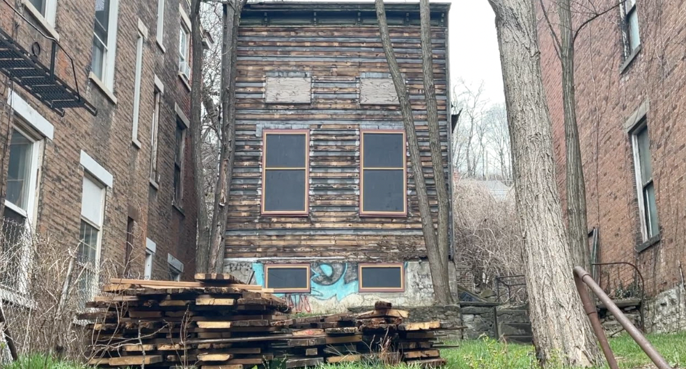 A house built in 1900 on W. McMicken Avenue has a collapsed roof and a floor that is caving in. 
