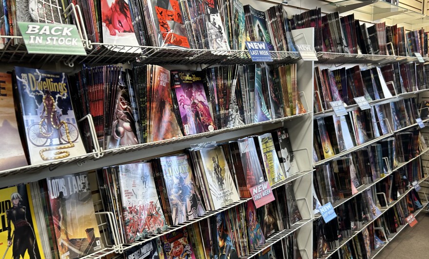 Shelves filled with comic book titles.