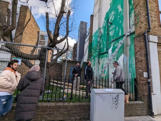 Some graffiti fans think Banksy has been spotted at the scene of his latest work