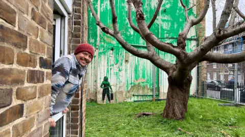 Laura Garcia Neighbour pops head out of window