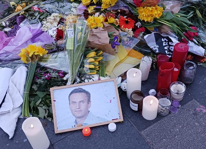 An improvised memorial on O'Connell Street in Dublin on Feb. 26 honors Alexei Navalny, critic of Russian President Vladimir Putin, and who died Feb. 16 in an Arctic prison.