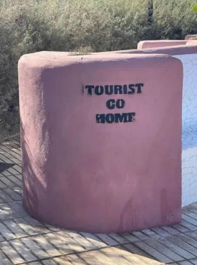 'TOURIST GO HOME' - This slogan couldn't be more straightforward as angry Islanders ask visitors to leave and return to their country of origin
