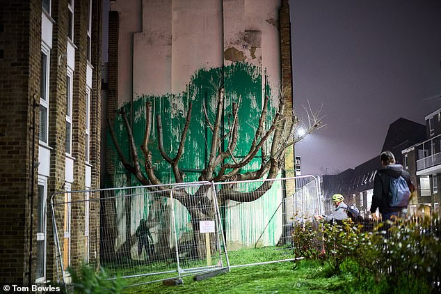 A protective fence has been erected in front of the painting in Finsbury Park, north London