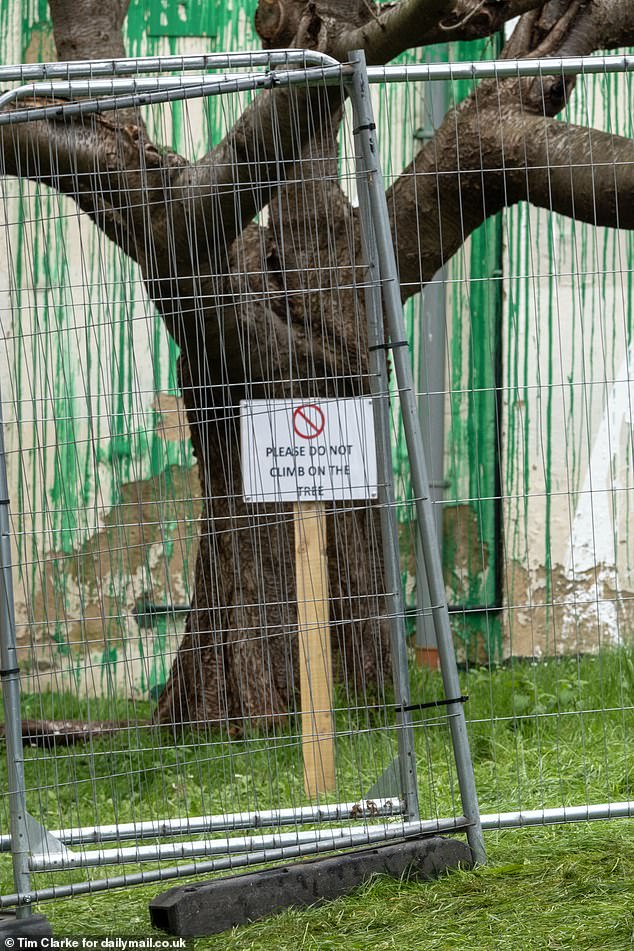 A metal security fence was erected by Islington Council around the piece to protect it from further vandalism