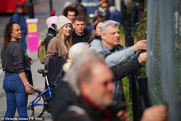 Visitors have continued to flock to see the mural, with viewers crowding the pavement and climbing on nearby walls to take photographs and selfies with the artwork