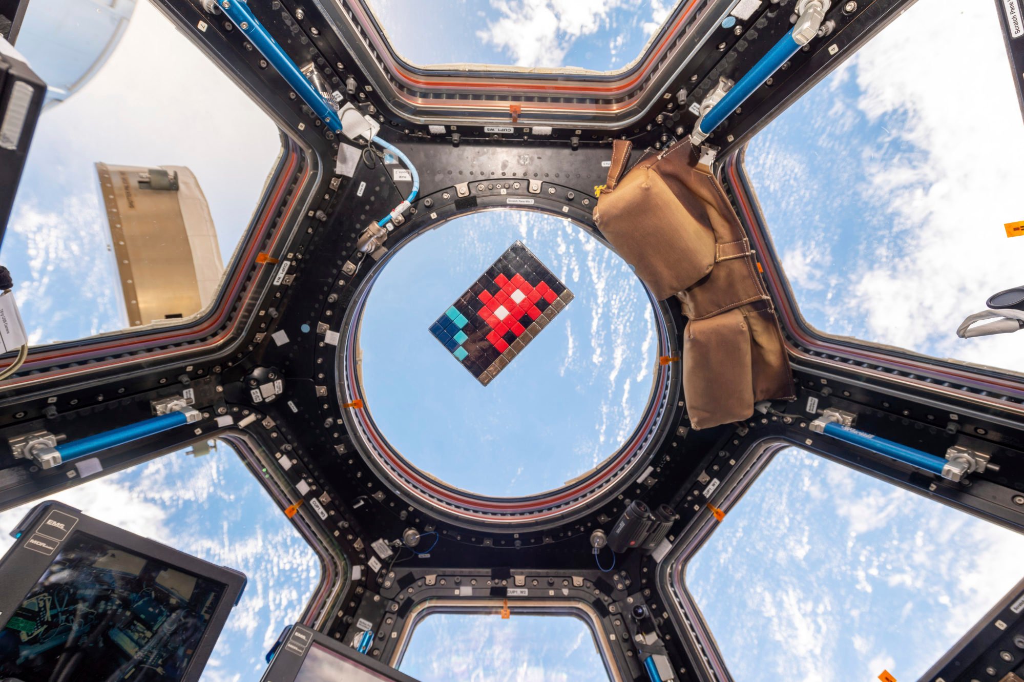 An Invader mosaic floats in the International Space Station in 2015. Photo: ESA-Nasa via AP