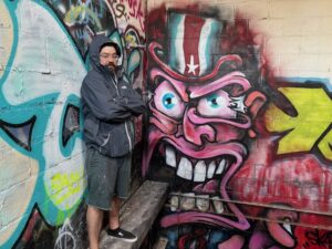 Skatchface with his painting,
