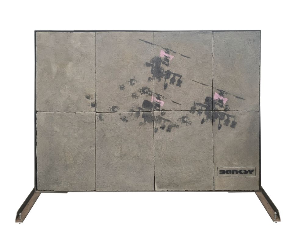 Graffiti painting of helicopters on stone block