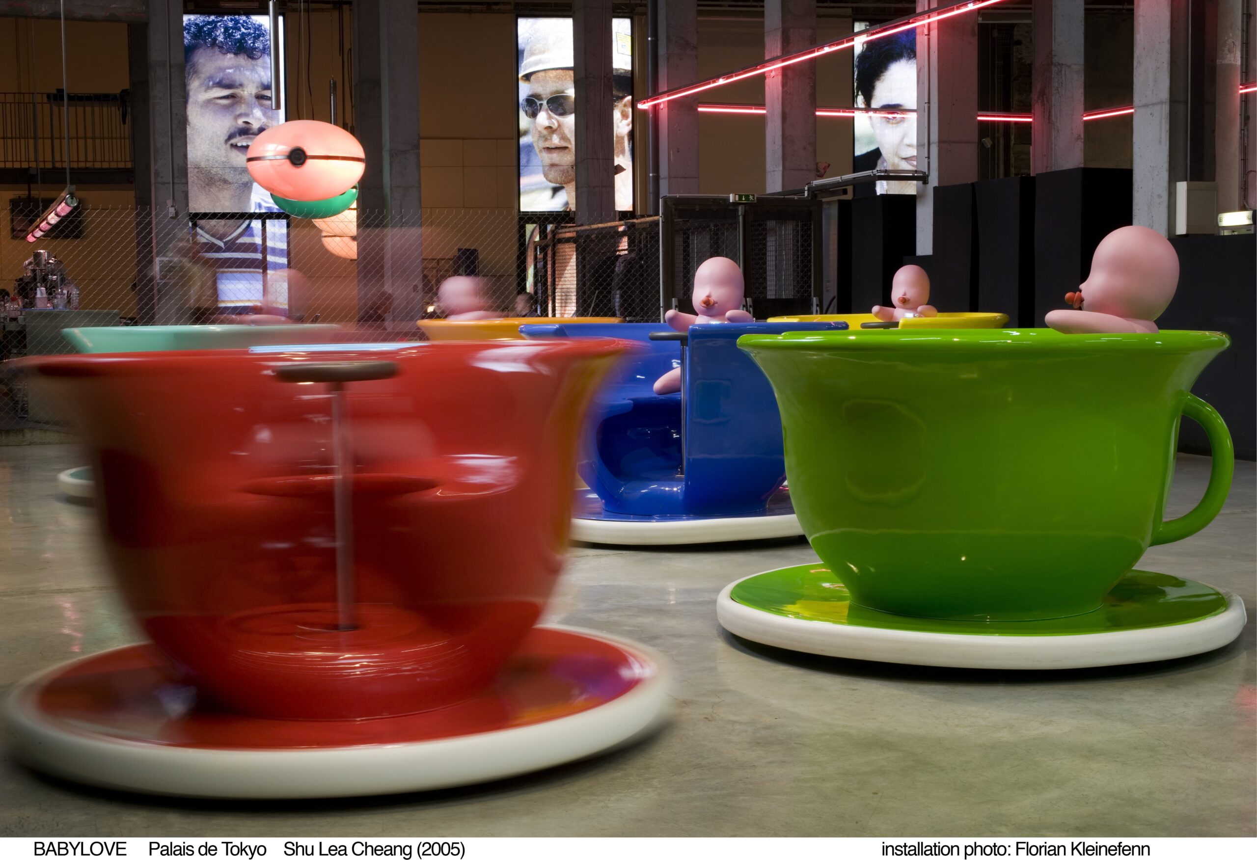 Large teacups swirl around in gallery
