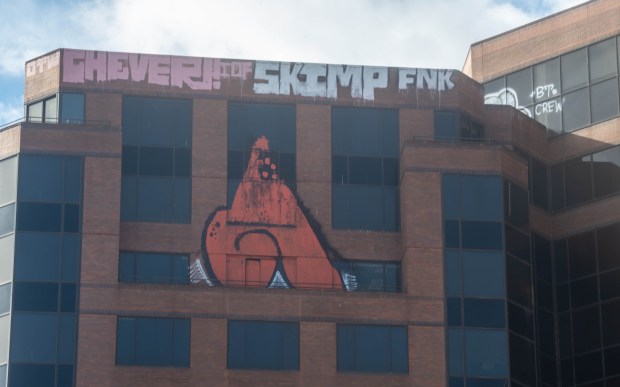 Graffiti covers the top of 25 Sigourney St. Hartford.he former 15-story Connecticut Department of Social Service building at 25 Sigourney Street on Monday, March 18, 2024. (Aaron Flaum/Hartford Courant)
