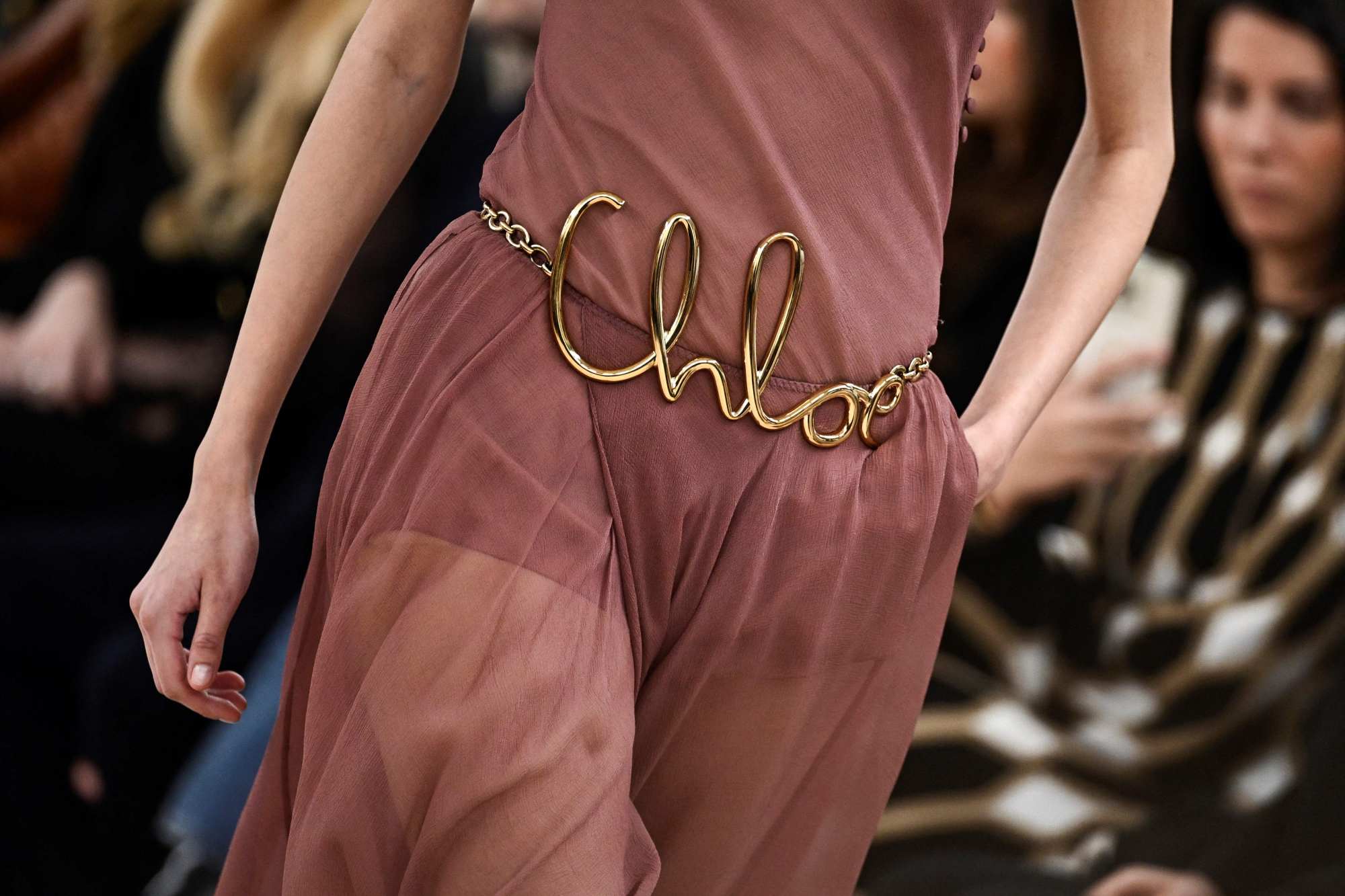 Chain belts with “Chloé” in cursive script at the brand’s autumn/winter 2024 show. Photo: AFP