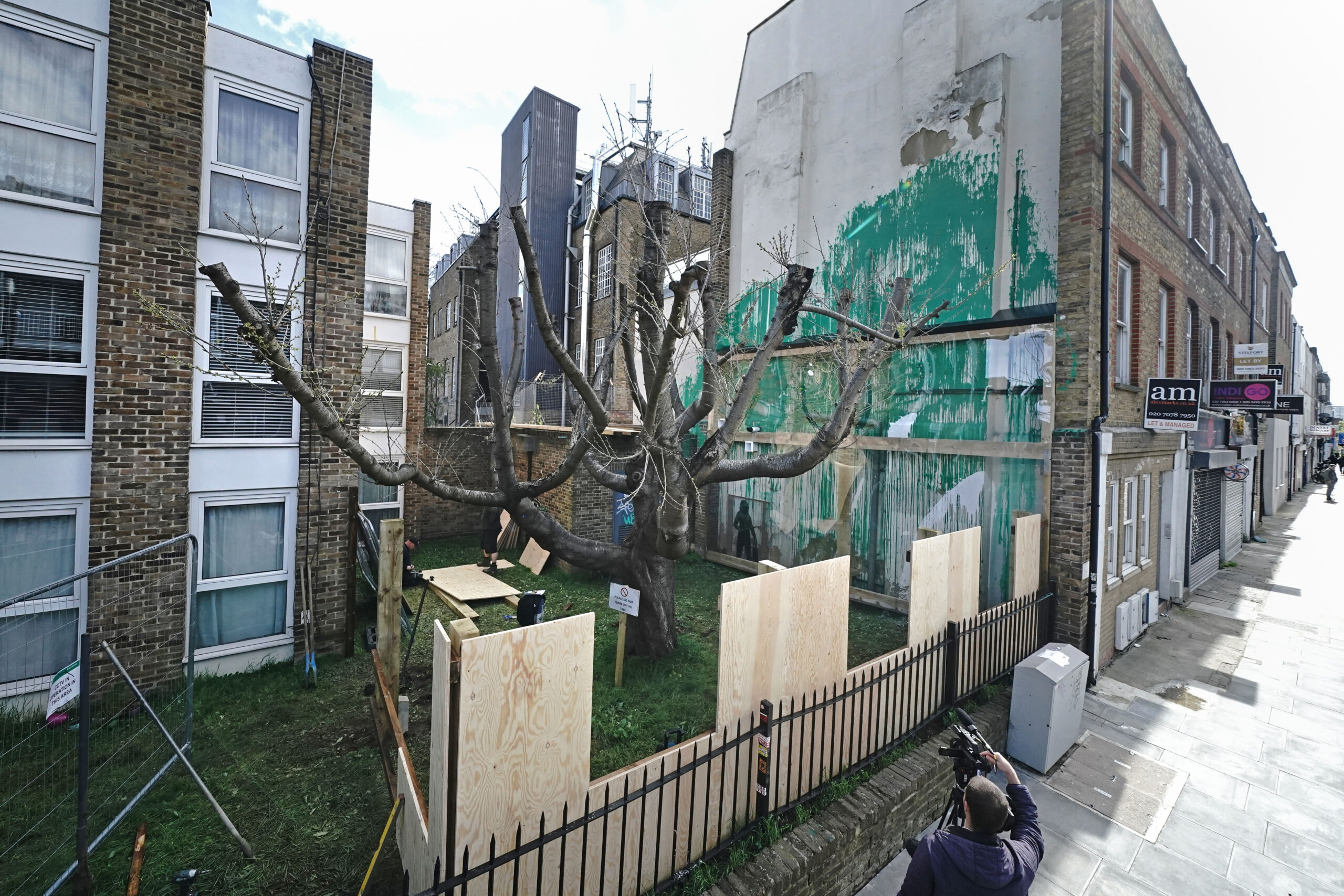The landlord of the building has covered the work with perspex for protection
