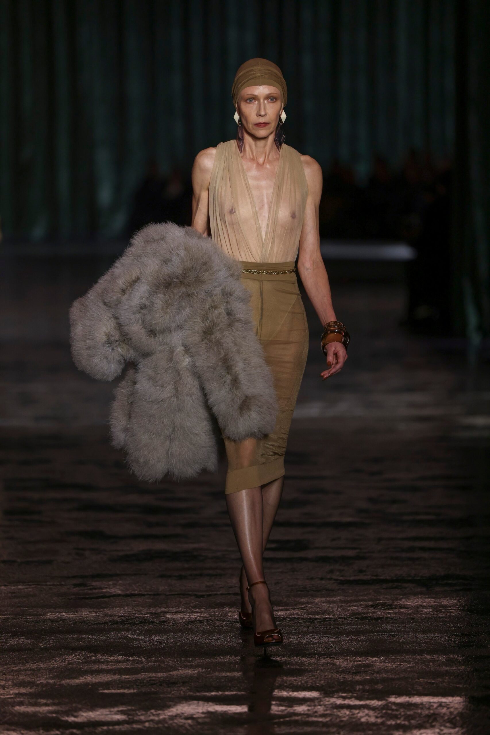 Models carried fur coats at the Saint Laurent autumn/winter 2024 show. Photo: AP