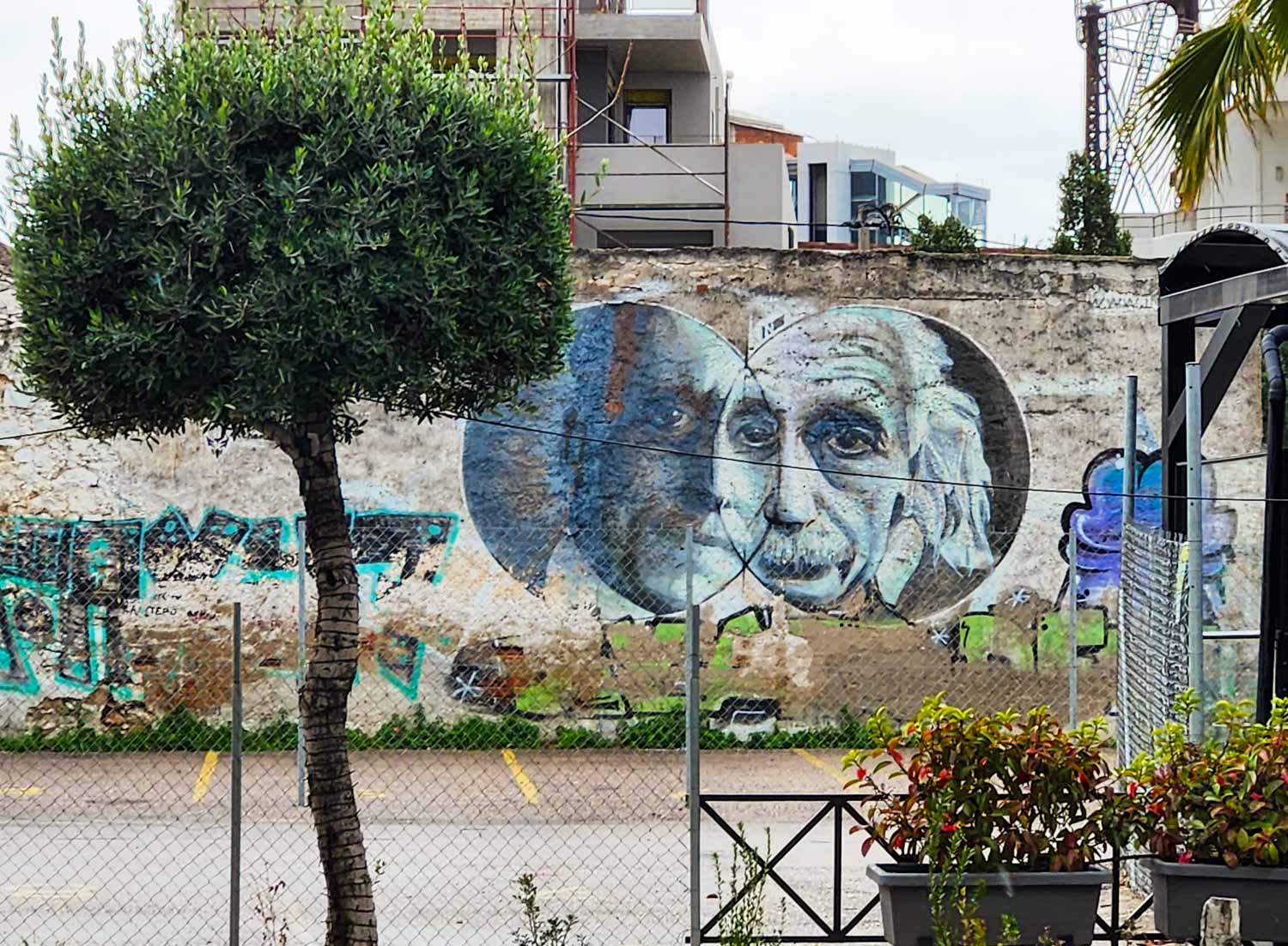 Street art of Albert Einstein and Greek mathematician Constantin Carathéodory on a crumbling wall in Athens - my street art tour of Athens review