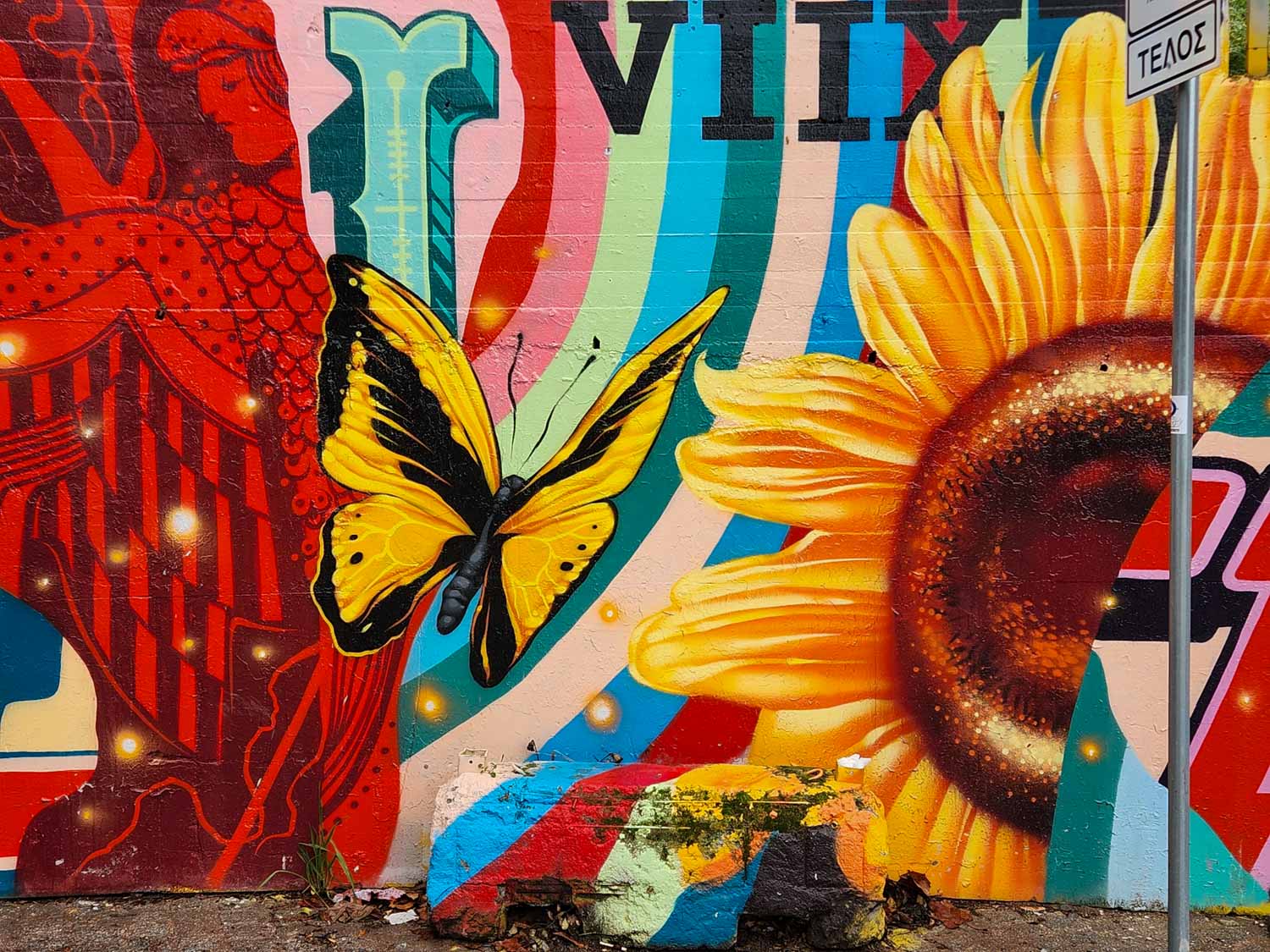 Brightly coloured street art in Athens - one of many pieces to see on a street art tour of Athens with kids
