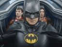 This image released by Warner Bros. Pictures shows Ezra Miller, from left, Michael Keaton and Ezra Miller in a scene from