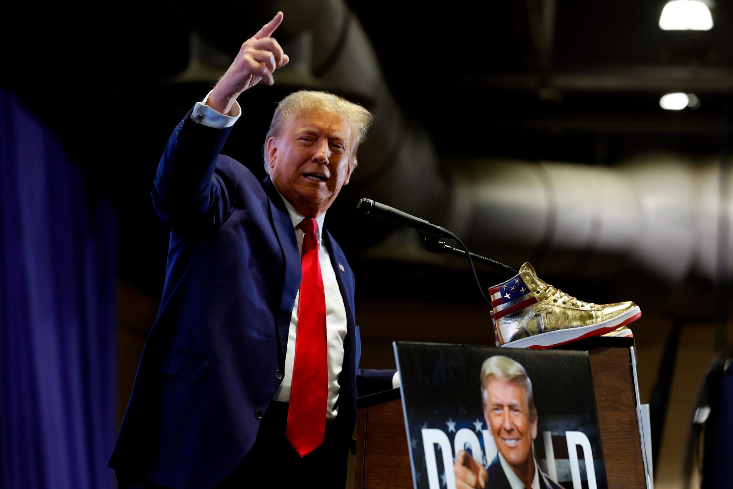 PHOTO: Republican presidential candidate and former President Donald Trump takes the stage to introduce a new line of signature shoes at Sneaker Con at the Philadelphia Convention Center, Feb. 17, 2024, in Philadelphia.