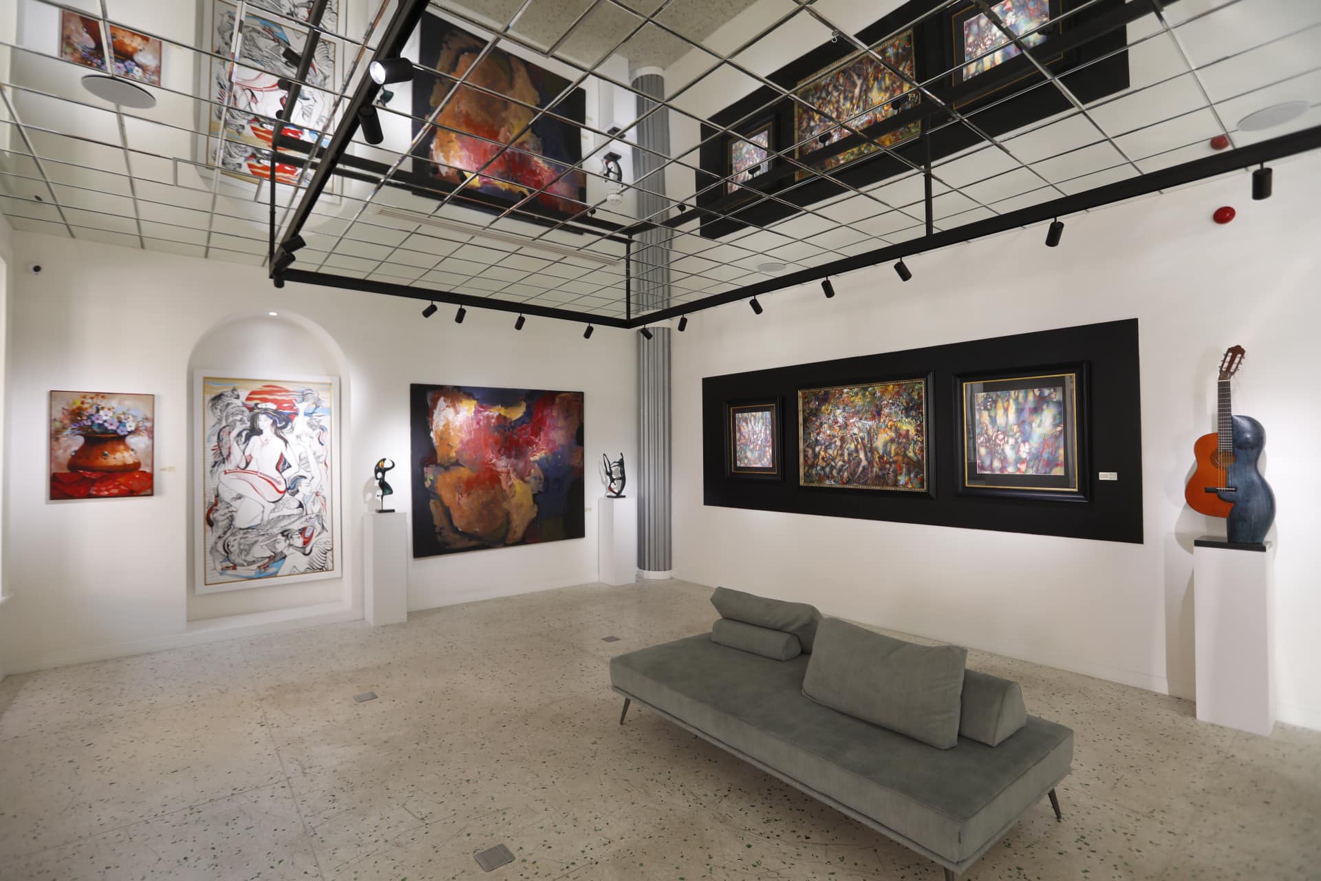 The interior of an art gallery with a tall ceiling
