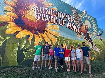 The Sunflower State of Mind' is A Mural Movement Clay Center's 25th mural. The mural was painted in 2022 by C. Stanley Creative from Orlando, Florida. Located in downtown Clay Center on the Ward Craft Home Store building located at 531 Court Street. <b>Image Courtesy C. Stanley Creative </b>
