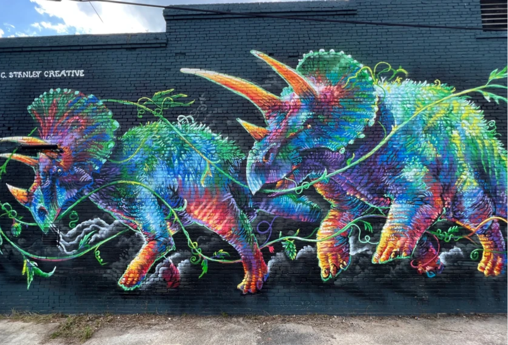 <b>EXAMPLE OF PREVIOUS ARTWORK: </b>Triceratops mural painted by Stanley in Macon, Ga.