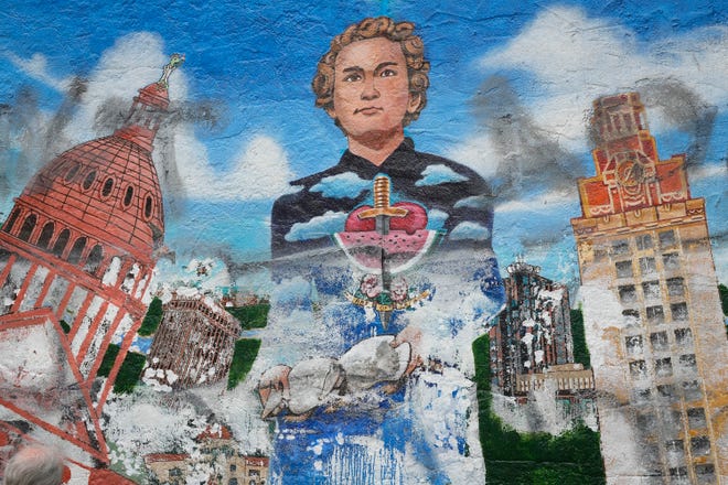 Detail of the “Austintatious” mural by Kerry Awn, Tom Bauman and Rick Turner which they originally painted as University of Texas art students in 1973, on the north wall of the University Co-Op Monday April 1, 2024.