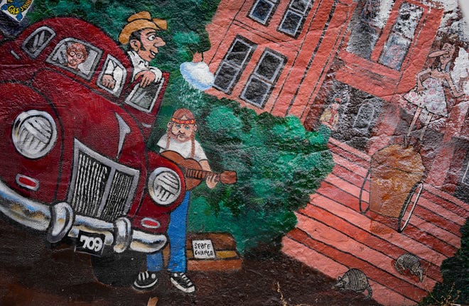Detail of the “Austintatious” mural by Kerry Awn, Tom Bauman and Rick Turner which they originally painted as University of Texas art students in 1973, on the north wall of the University Co-Op Monday April 1, 2024.