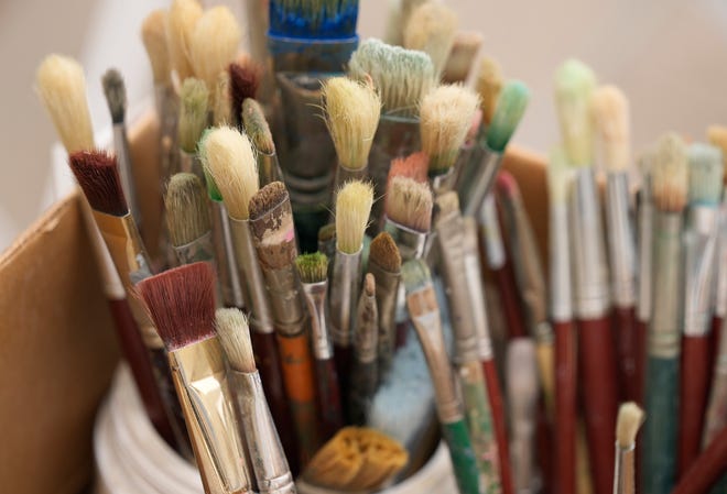 Paint brushes used by Tom Bauman, Kerry Awn, and Rick Turner to restore their “Austintatious” mural they originally painted as University of Texas art students in 1973, on the north wall of the University Co-Op Monday April 1, 2024.
