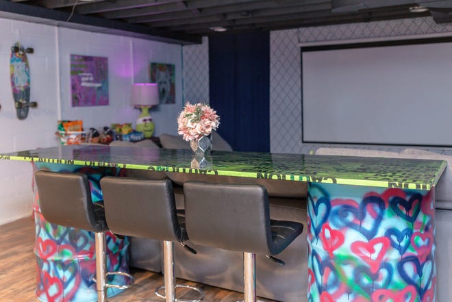 This bar top at this home in Louisville's Fern Creek area was crafted with wood, caution tape, and resin.